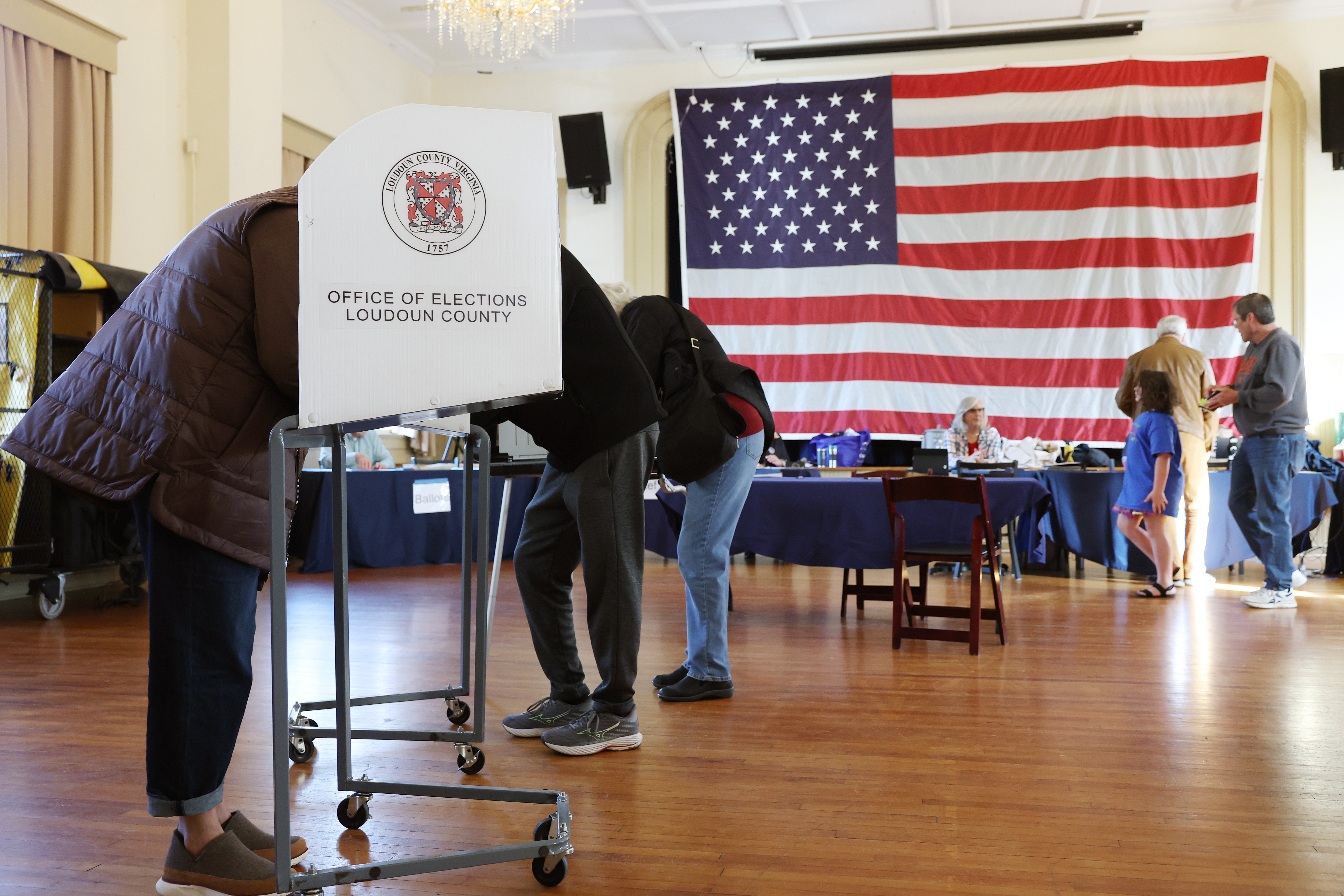 Voters fill out their ballots on Nov. 4 at a polling station in Hillsboro, Va. Virginia is one of just three states where only the governor can restore voting rights for people with felony convictions.